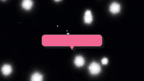 pink speech bubble animation over glowing white lights on black background