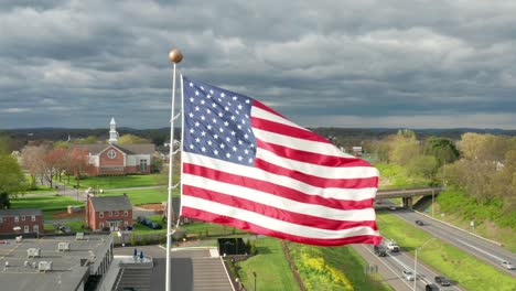 american flag waves proudly in wind