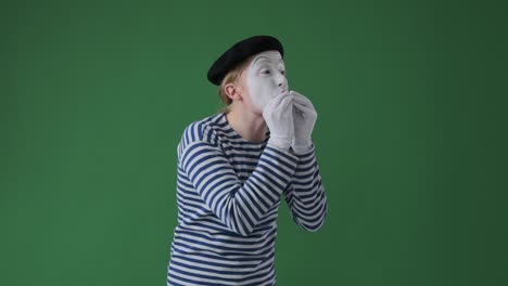 mime artist blowing kisses from the stage