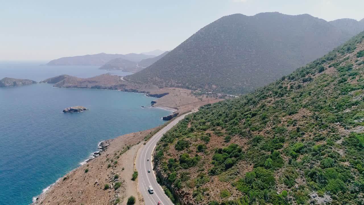 A shot from a drone of a road on the coast of the Greek island of Crete