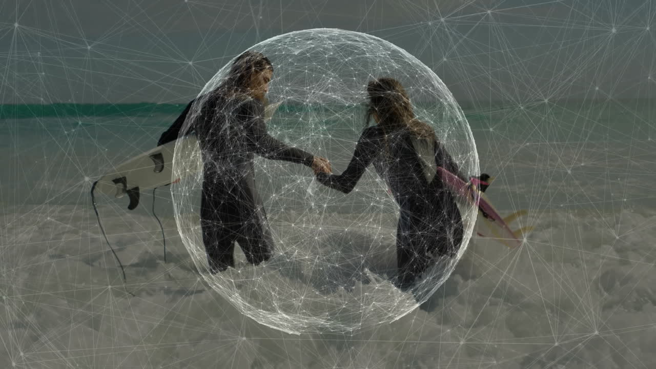 male and female surfers holding hands in surf, showcasing AR technology wireframe sphere overlay