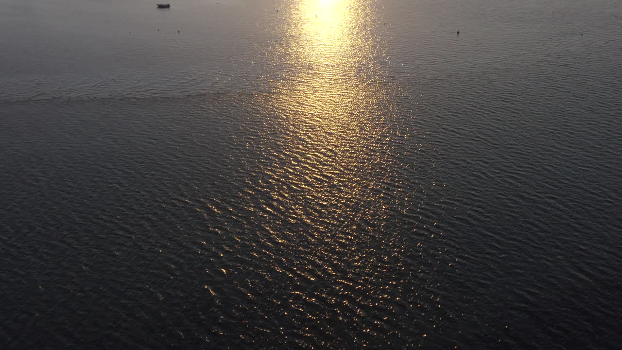Golden Sun Reflecting On The Waters Of Ria Formosa Lagoon In Algarve, Portugal At Sunset