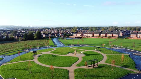 modern circular cemetery pathway design aerial view artistic garden of rest low horizon rising shot tilt down