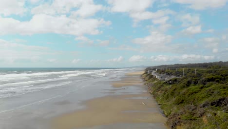 oregon coast flying drone over sea cliffs and beach