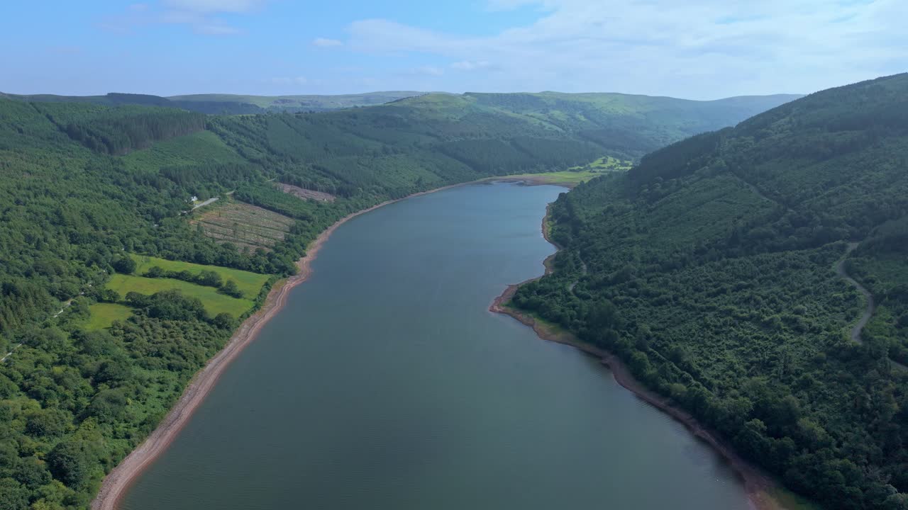 High angle view of a vast water reservoir and rolling hills in the Welsh countryside