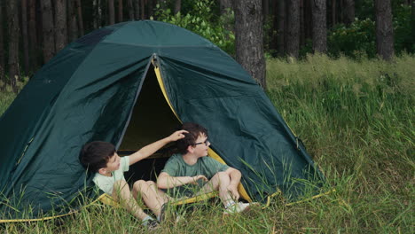 kids inside a camping tent