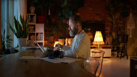 man working from home at night