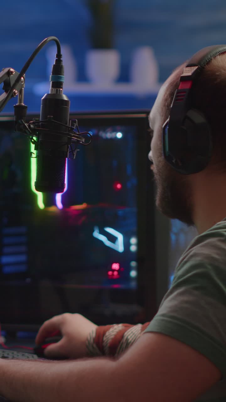 Gamer Playing Video Games on PC with Microphone and Headphones