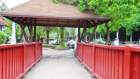 red bridge passageway in a tropical city