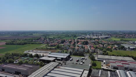 aerial of arcore monza brianza cityscape with factory buildings and countryside