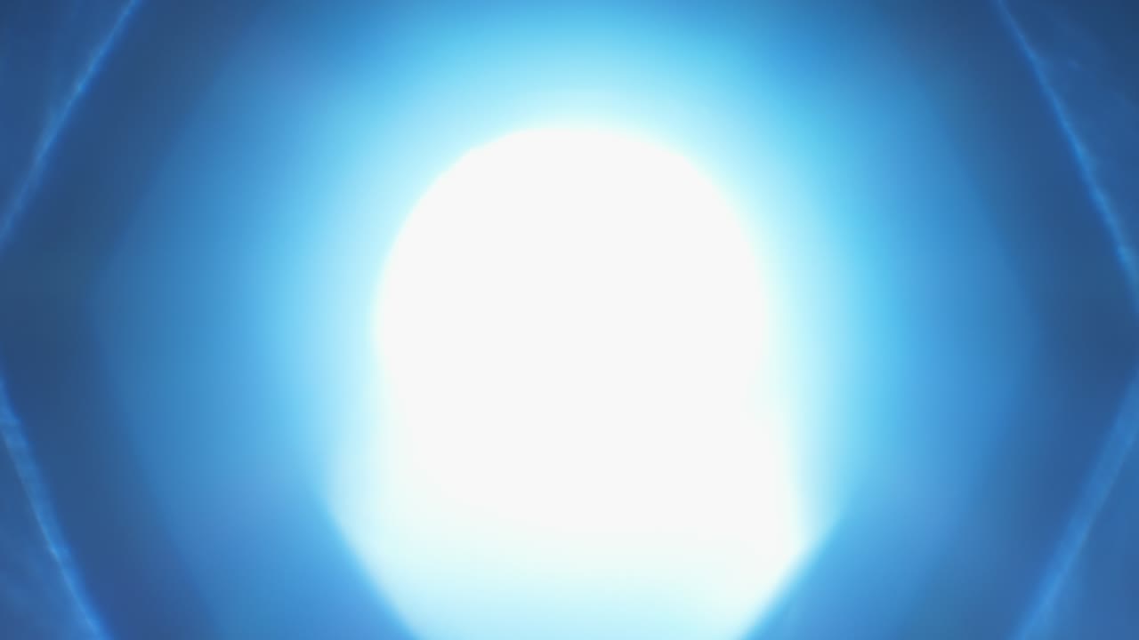 Iris blades slowly opening with blue light shining through old camera lens, fade out to white