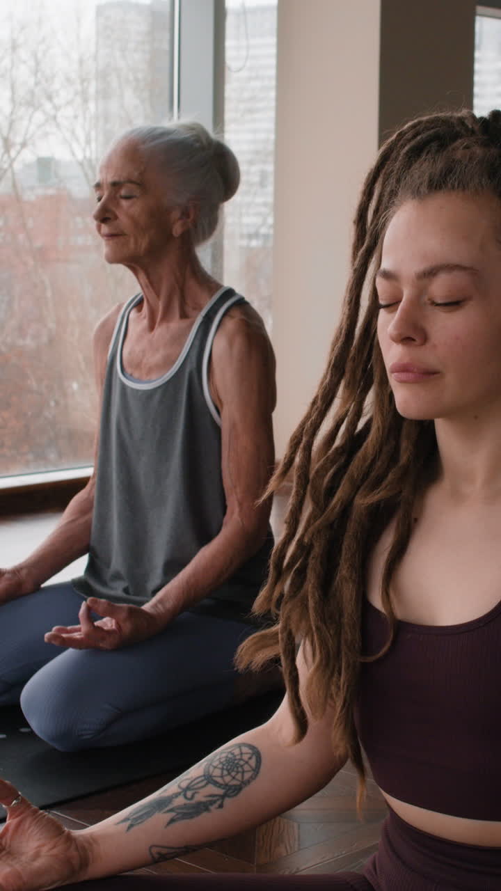 Diverse Group Meditating in Yoga Studio