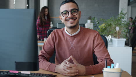 man sitting at desk in modern office