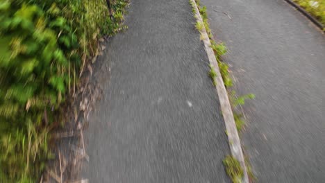 hyperlapse pov running with motion blur along pavement with male runners feet at bottom. exercise fitness point of view footage.