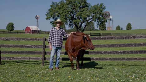 farmer and cow in a rural setting