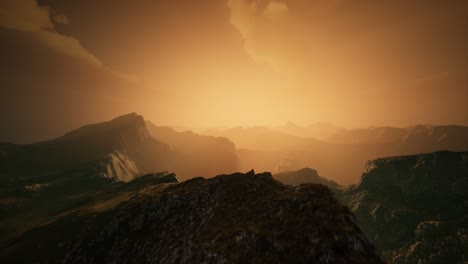 high mountain peaks covered with dramatic heavy fog