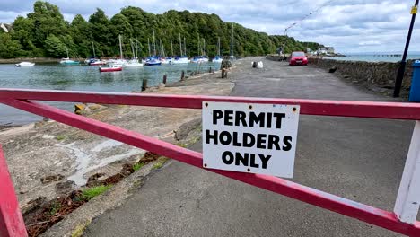 restricted access area with parked boats visible