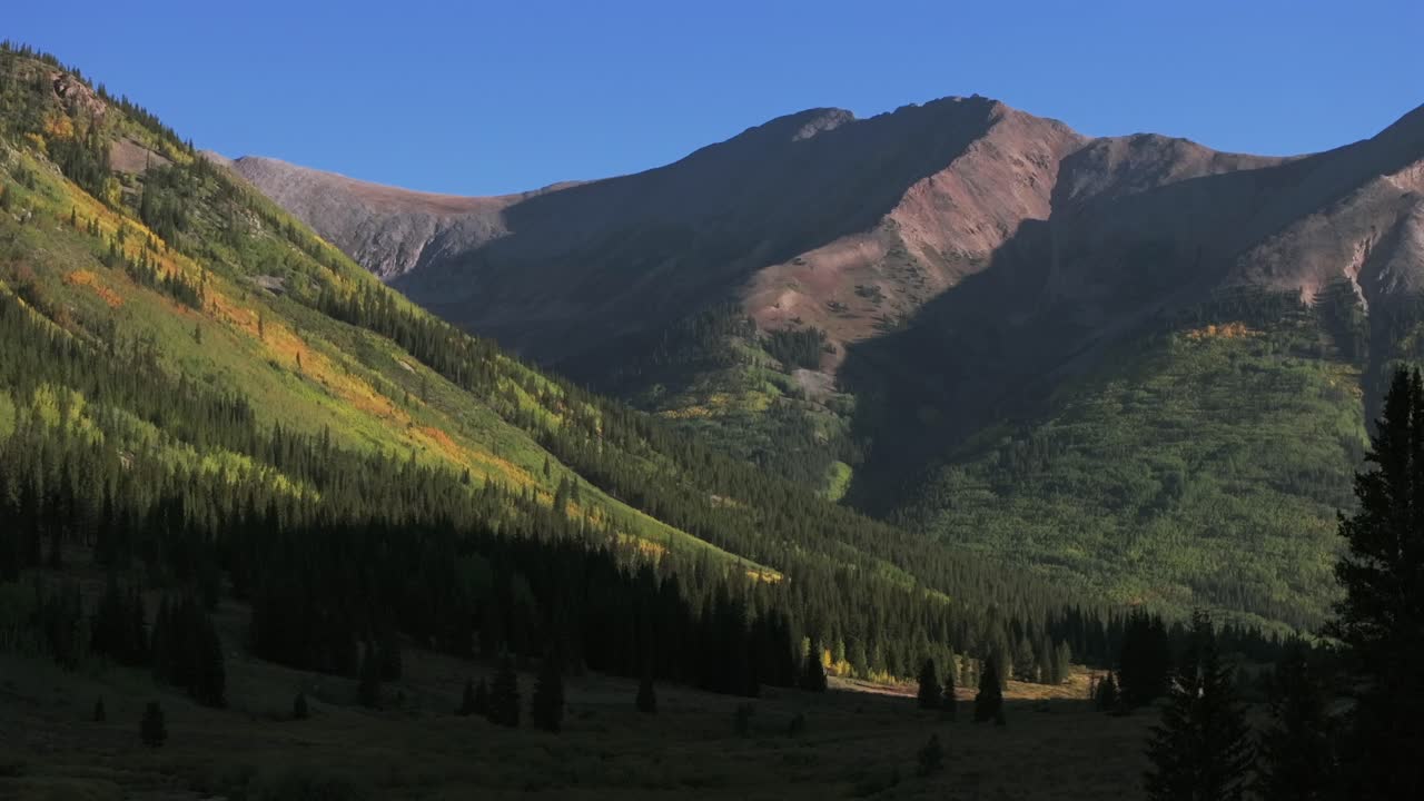Winfield Ghost Town Huron Peak trailhead valley La Plata Buena Vista Collegiate Peaks summer fall autumn Rocky Mountains Colorado drone aerial Aspen Trees sunny blue sky upward motion