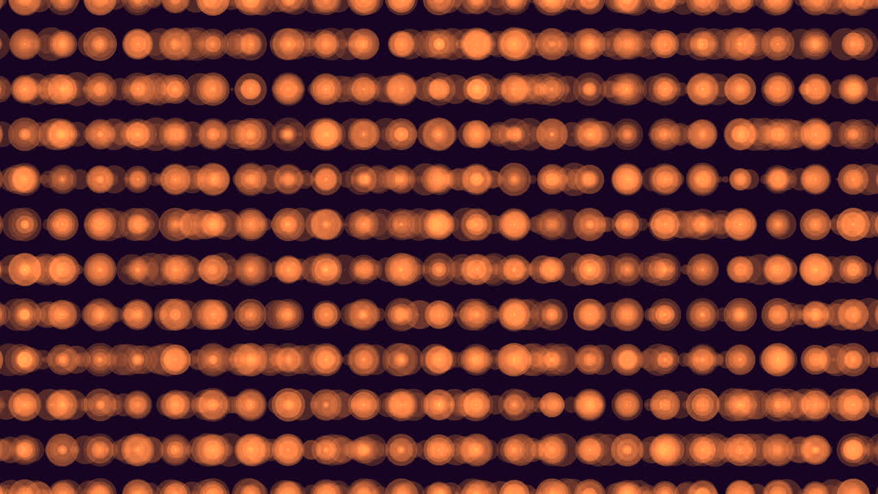 Defocused warm orange bokeh lights arranged in horizontal rows on a dark background, creating an abstract festive pattern for overlays, intros, and motion design