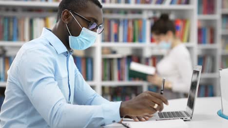 student studying in a library