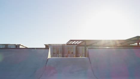 a young man skateboarding at a skatepark