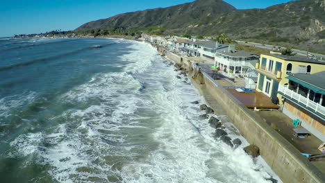 Aerials-over-waves-crashing-into-the-California-coast-during-a-big-storm