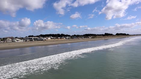 new brighton beach in christchurch new zealand on a bright morning