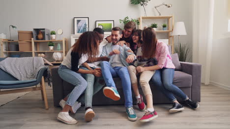 friends having fun on a sofa