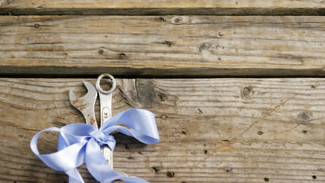 decorated old work tools on wooden plank