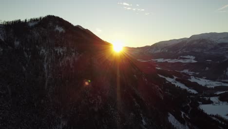 Aerial-view-of-a-mountain-revealing-morning-sunrise-in-Austrian-Alps