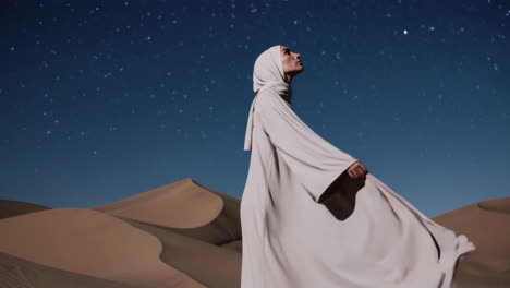 woman in desert under stars