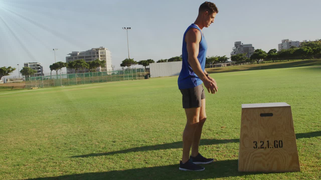 Male athlete shifting, jumping onto plyo box, countdown icons syncing music around him for fitness