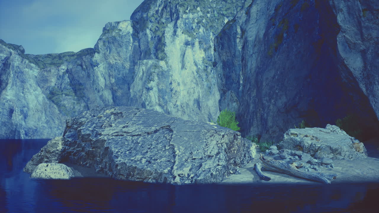 Exploring the serene beauty of rocky cliffs and tranquil waters at dusk