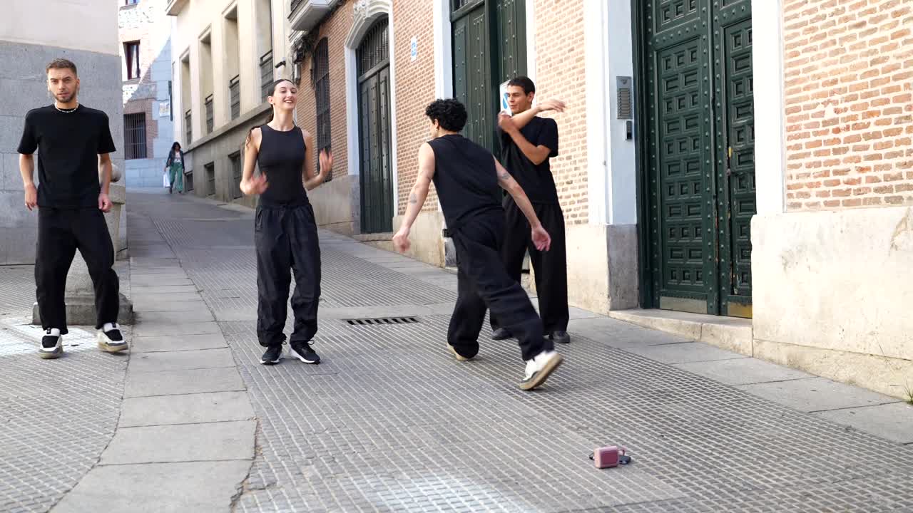 Group of people dancing on a city street