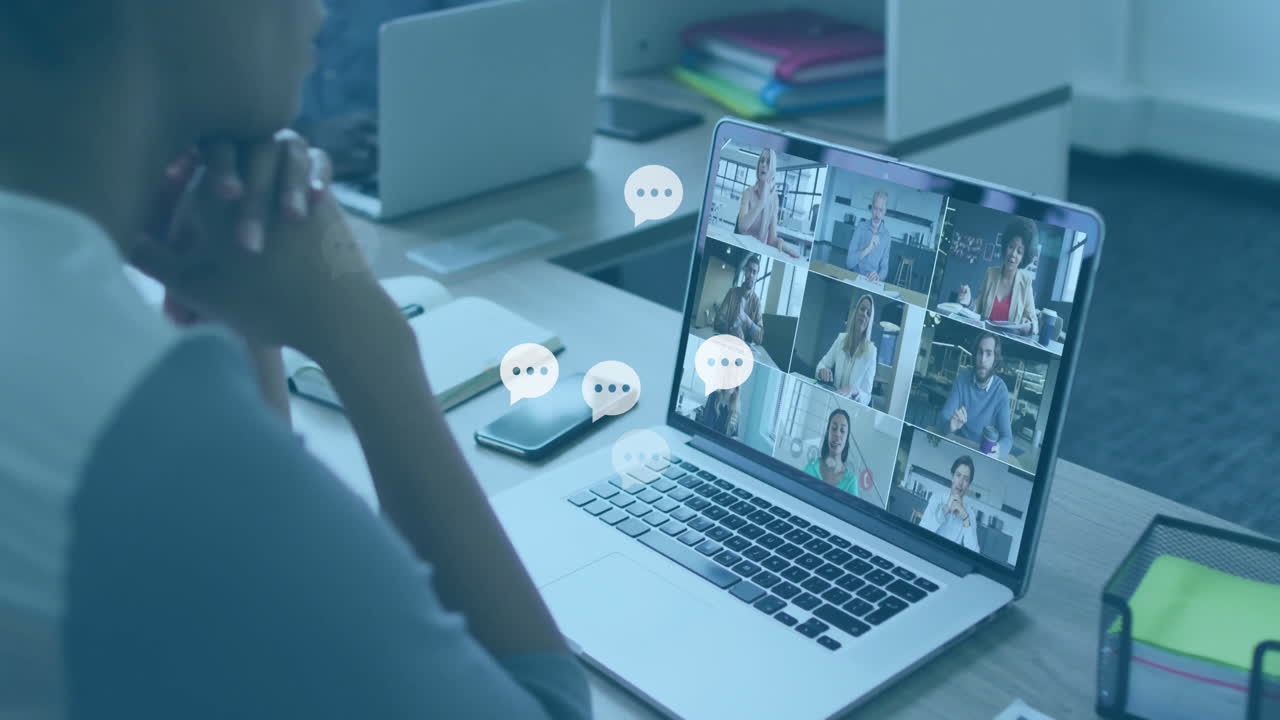 woman joining remote business meeting at desk, with animated data charts floating above laptop