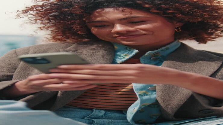 Young Businesswoman Using Smartphone in the City