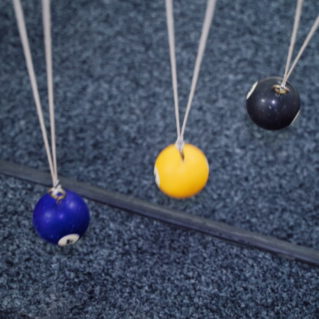 Newton's cradle showing laws of physics in motion. Museum of Science