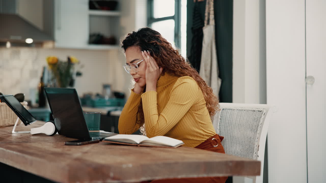 Woman with Headache Working on Laptop at Home