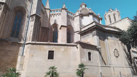 historic tarragona cathedral with stunning gothic architecture under a clear, sunny sky. pan right