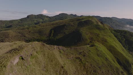 Drone-Flies-Above-Countryside-Mountains-Landscape-In-Panama-During-Sunrise,-El-Valle-De-Anton-Crater