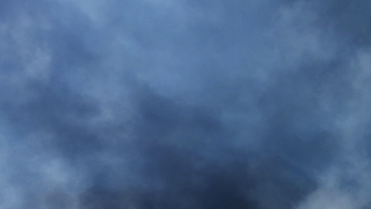 POV of a cloud in the sky that moves during a thunderstorm