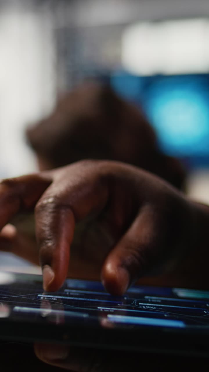 Vertical video Close up of tablet used by admin in office doing software development