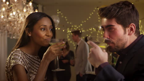 Couple-Make-Toast-As-They-Celebrate-At-Party-Together