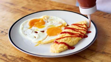 omelet garnished with ketchup in ayutthaya, thailand