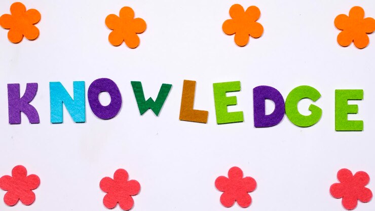 The word knowledge. The word is written in dancing letters in a colorful font.