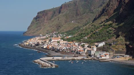 Paul-do-Mar,-traditional-fishing-village-Maderia,-Drone-establishing-shot-town-and-harbour