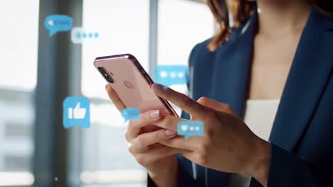 woman's hands using rose gold smartphone with message bubbles