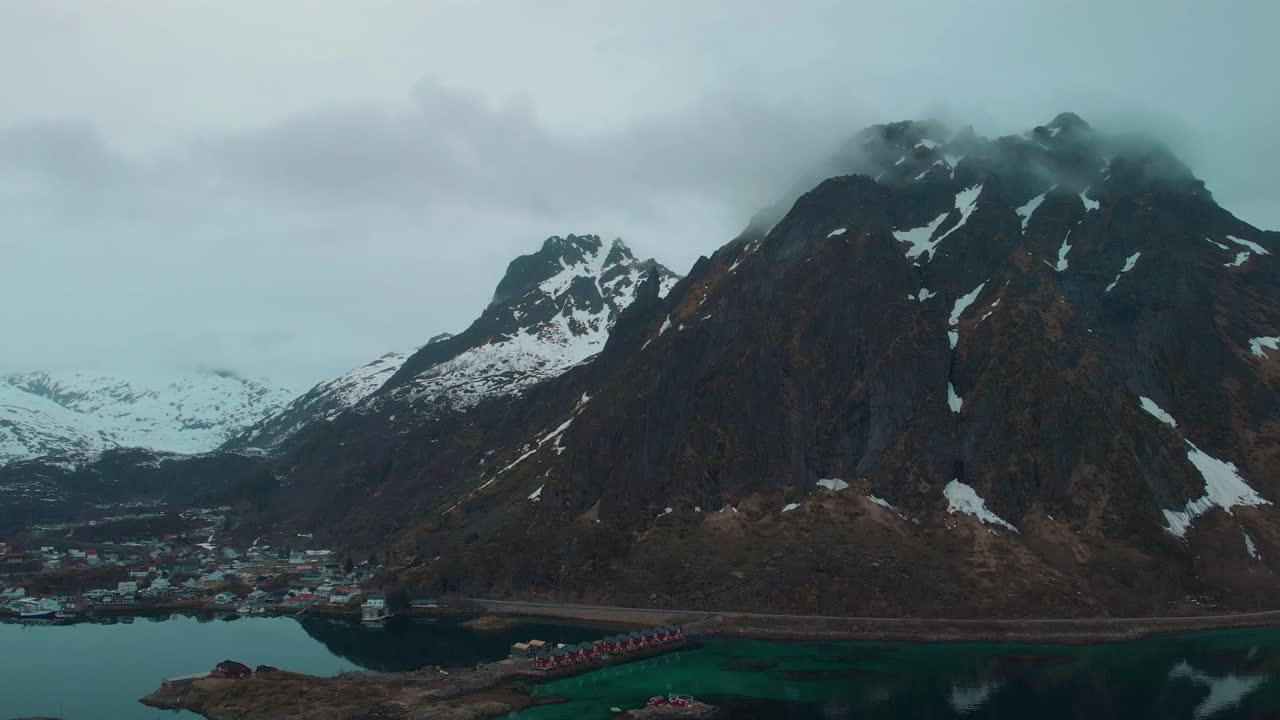 Dramatic aerial drone shot of foggy mountains in Lofoten Norway.