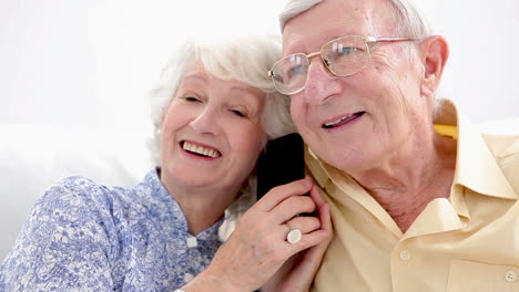 Old-couple-calling-on-the-phone