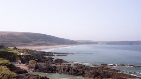 aerial flyover of a beautiful sandy beach in north devon on a summer’s morning